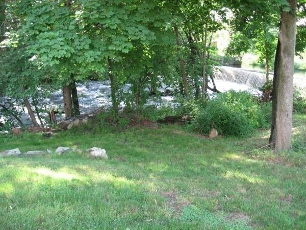 471 Gleasondale Road, Unit 1 Stow, MA 01775 - Photo 10 of 11 a view of a trees with a yard