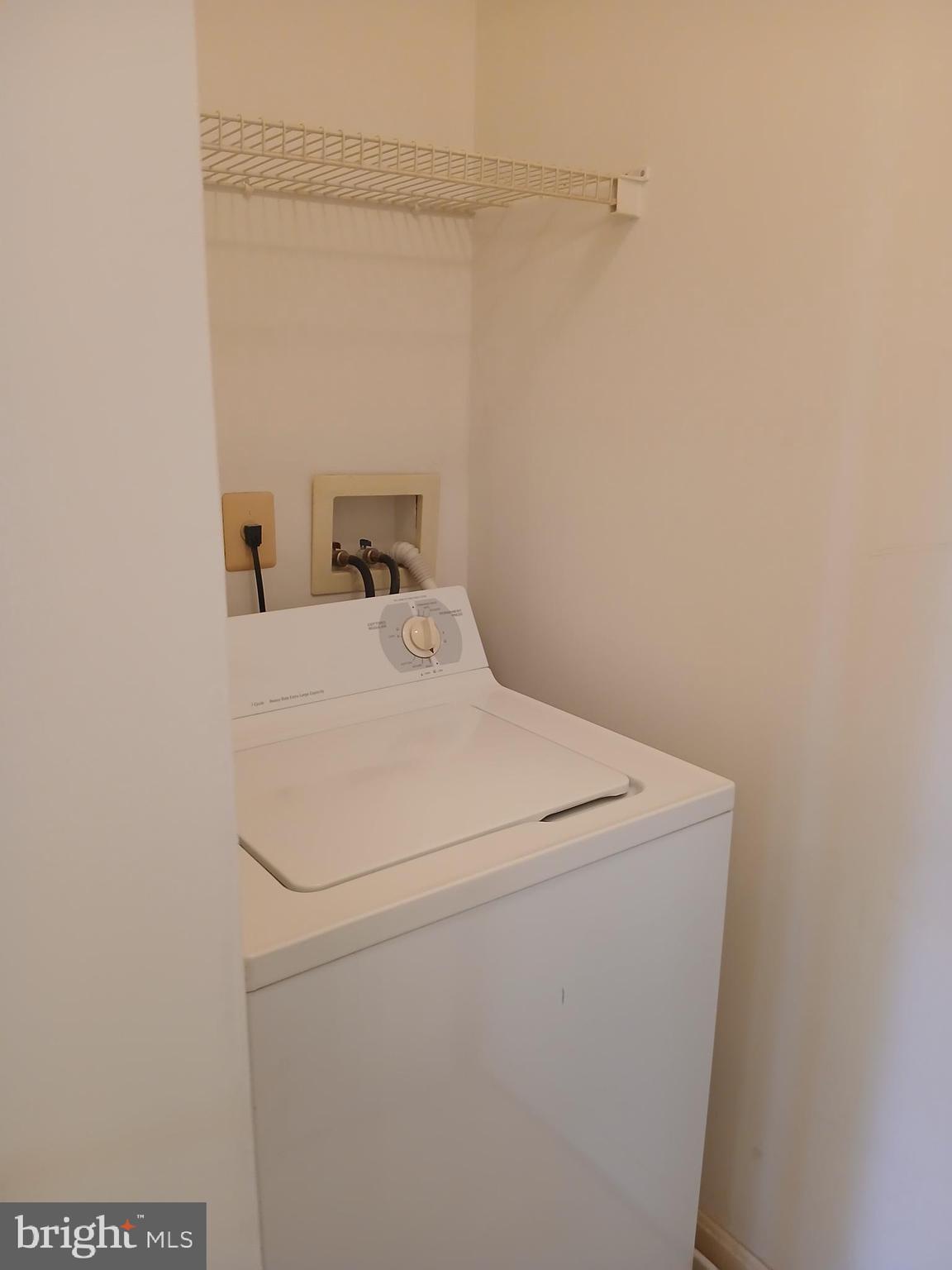 7201 Bogley Road, Unit 203 Windsor Mill, MD 21244 - Photo 12 of 21 a utility room with dryer and washer