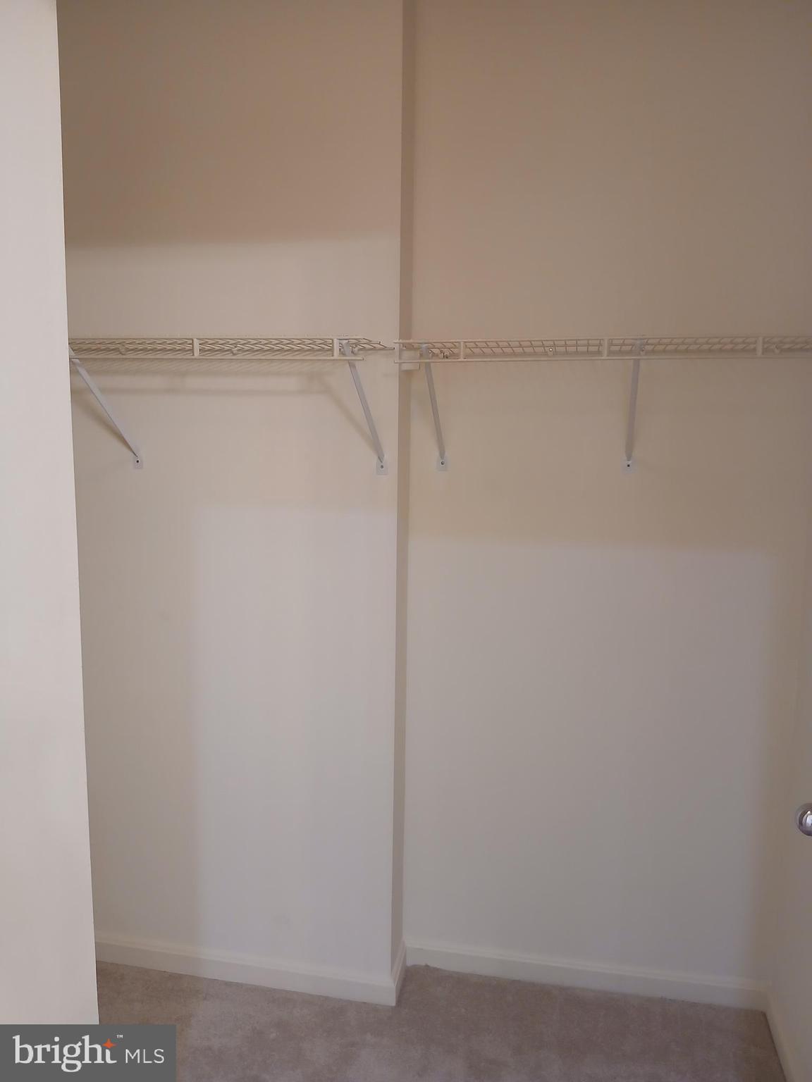 7201 Bogley Road, Unit 203 Windsor Mill, MD 21244 - Photo 19 of 21 a view of an empty walk in closet