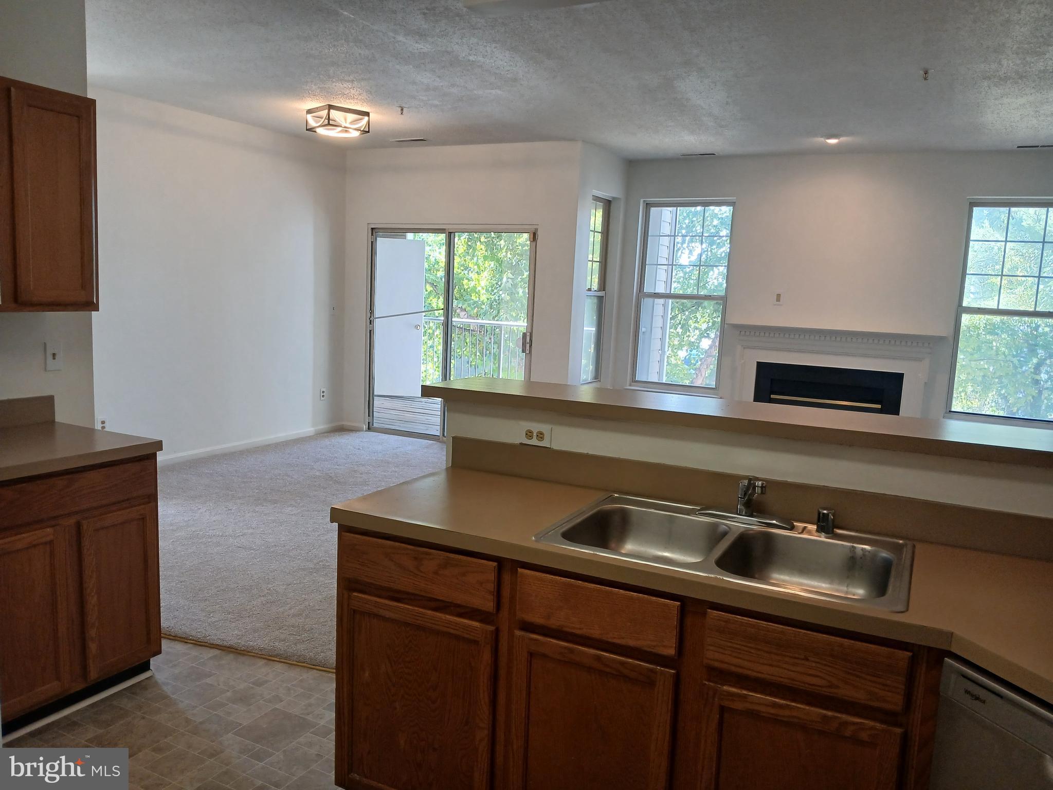 7201 Bogley Road, Unit 203 Windsor Mill, MD 21244 - Photo 4 of 21 a kitchen with a sink and a window