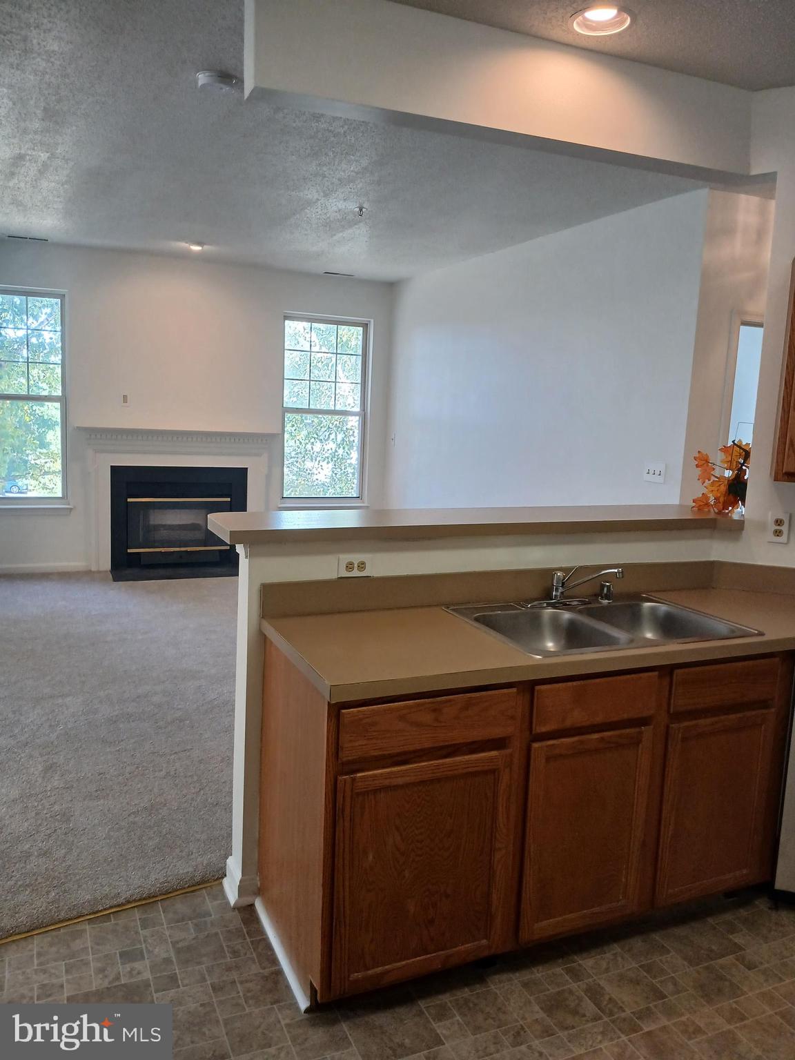 7201 Bogley Road, Unit 203 Windsor Mill, MD 21244 - Photo 6 of 21 a kitchen with a stove and a sink