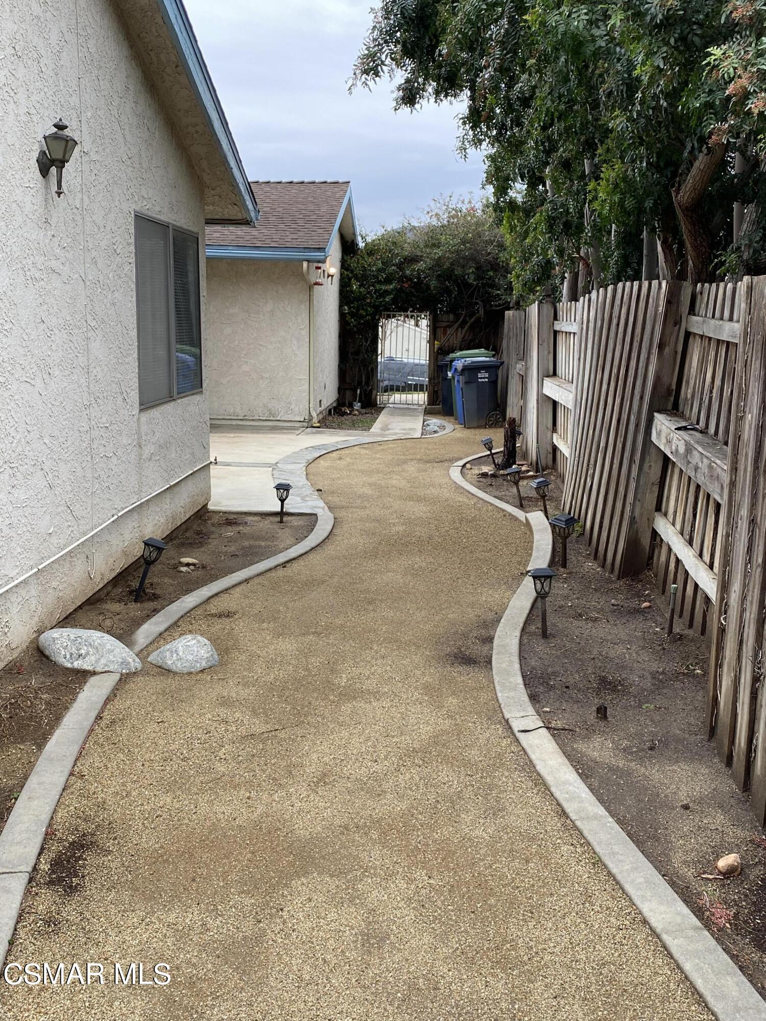 15063 Reedley Street Moorpark, CA 93021 - Photo 12 of 18 a backyard of a house with table and chairs