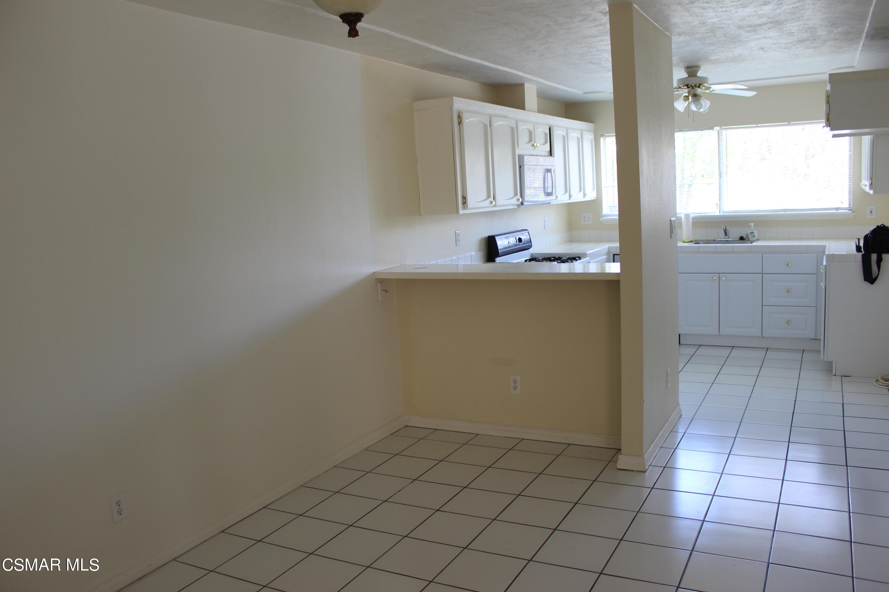 15063 Reedley Street Moorpark, CA 93021 - Photo 6 of 18 a bathroom with a sink toilet and shower