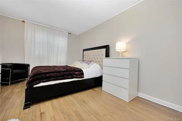 a bedroom with a bed and a television