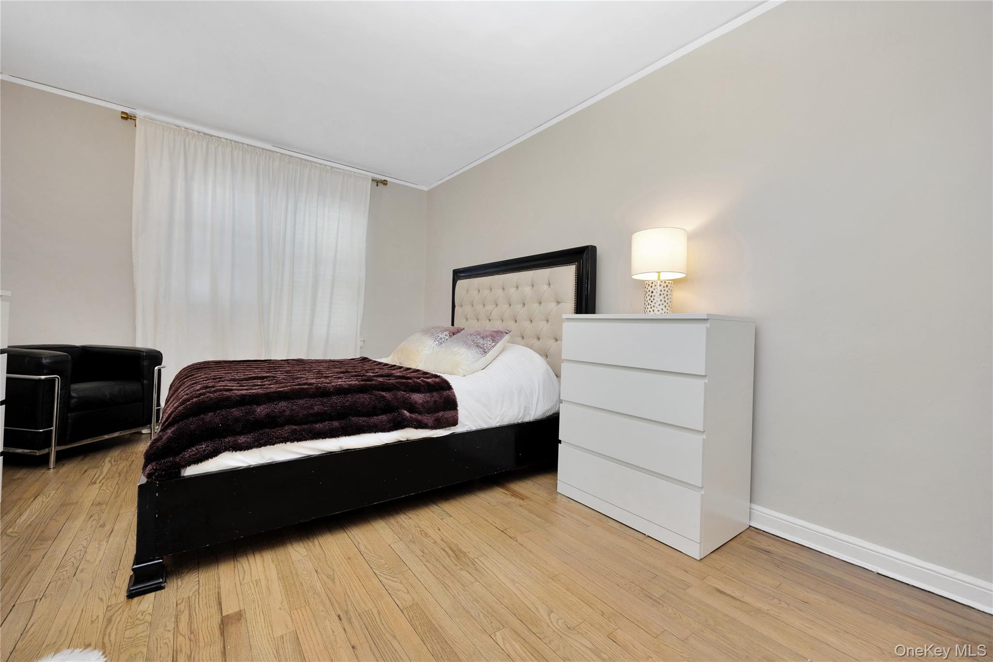 141-42 78th Road, Unit 1D Queens, NY 11367 - Photo 11 of 15 a bedroom with a bed and a closet