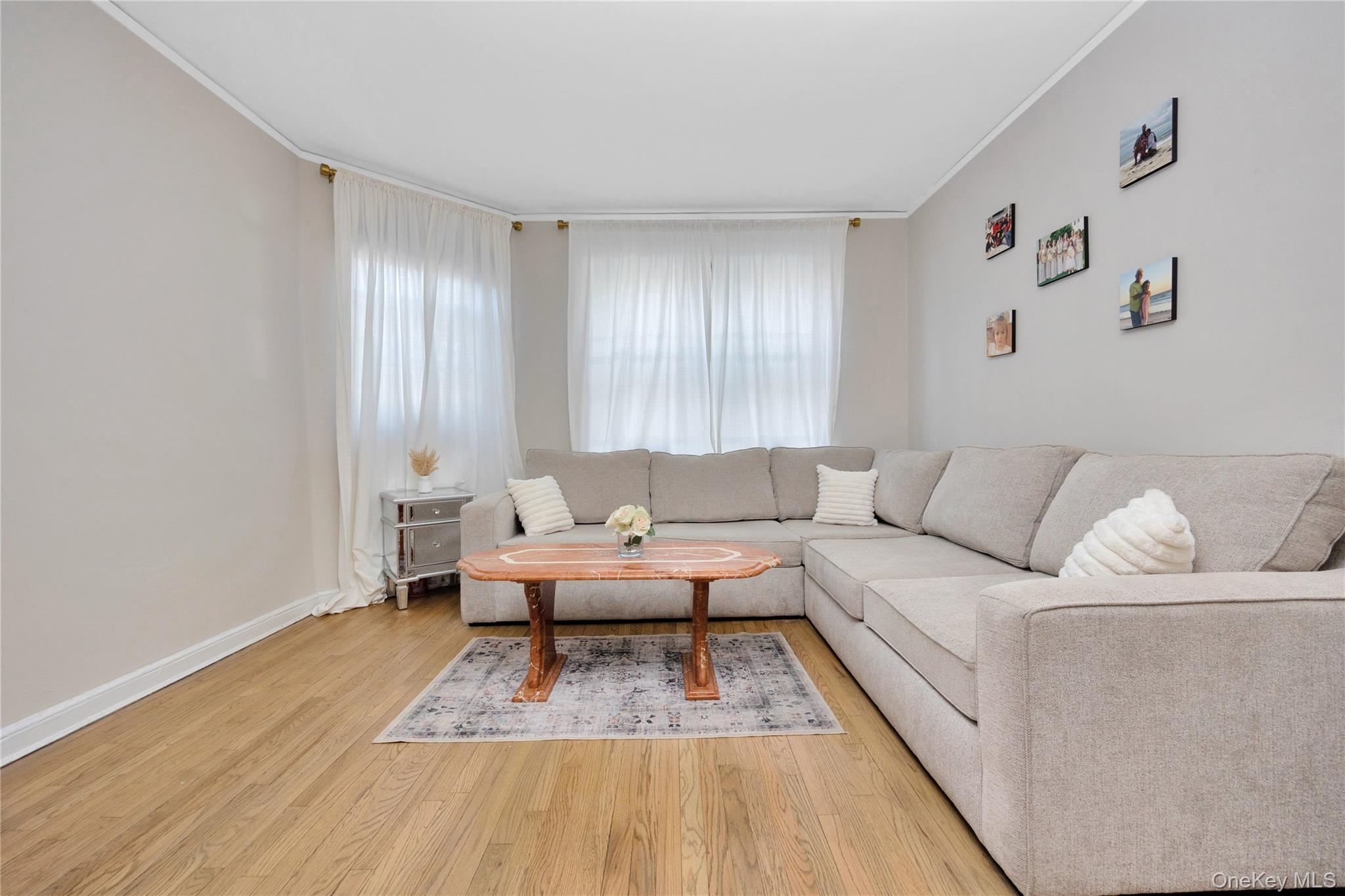 141-42 78th Road, Unit 1D Queens, NY 11367 - Photo 4 of 15 a living room with furniture and a couch