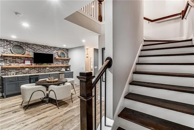 a view of a livingroom with furniture and a flat screen tv