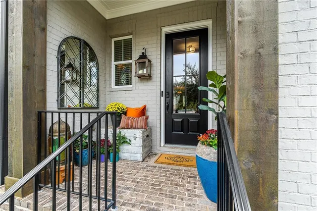 a view of front door and deck of house