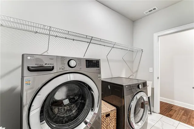 a utility room with dryer and washer