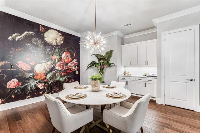 a view of a dining room with furniture and wooden floor
