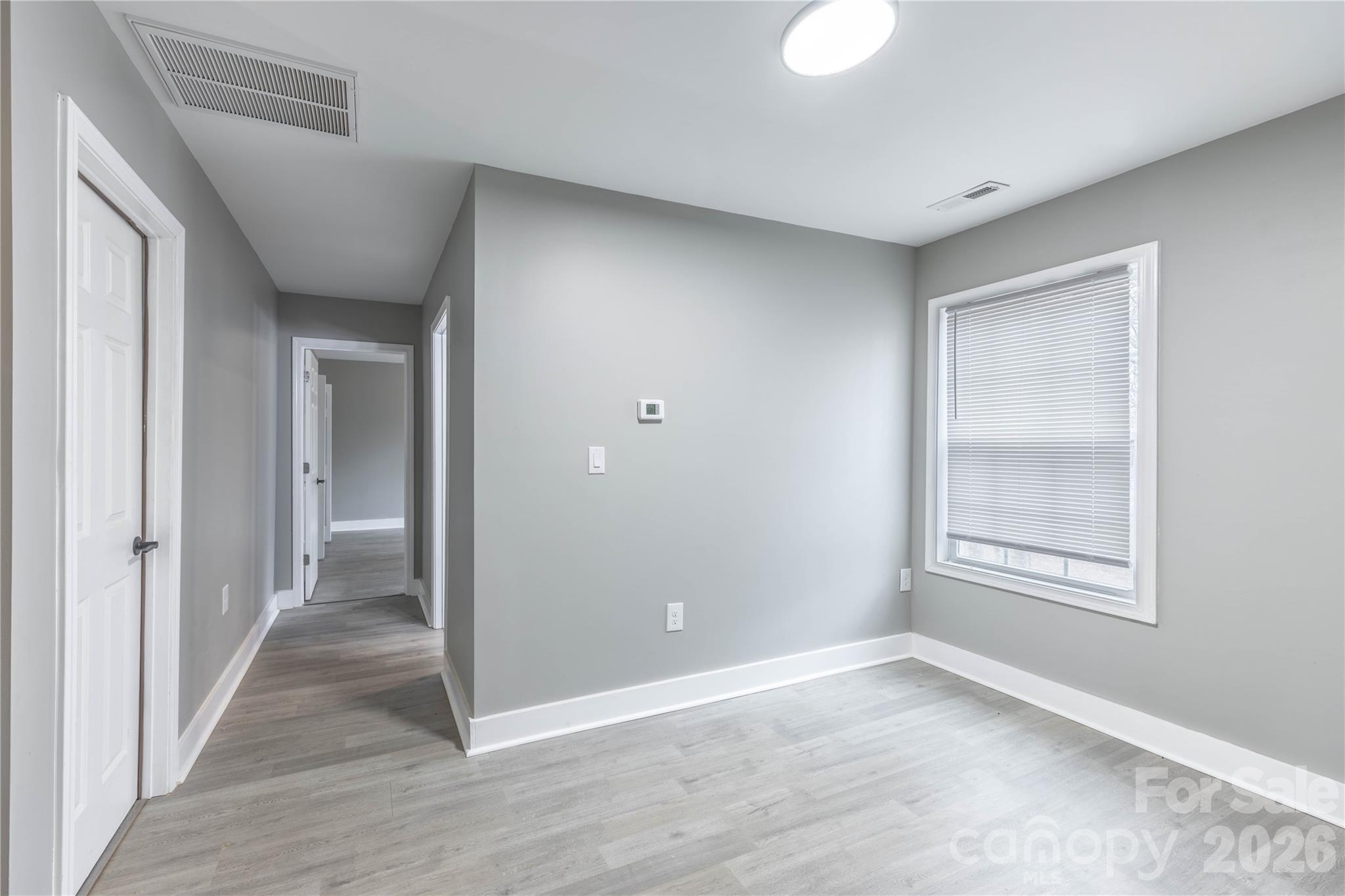 245 John Cline Road Cherryville, NC 28021 - Photo 17 of 29 a view of an empty room with wooden floor and a window