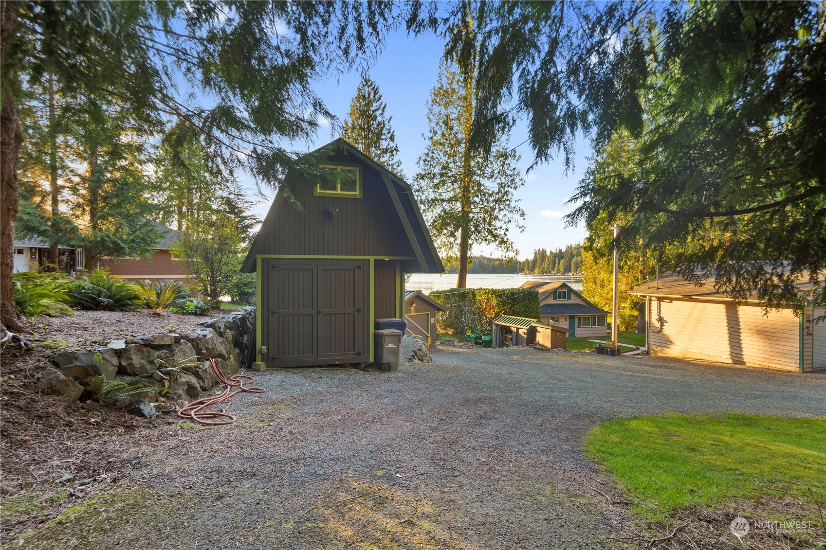 620 South Tulloch Road Snohomish, WA 98290 - Photo 32 of 38 a view of a yard with plants and a bench