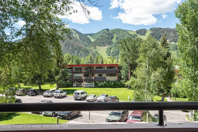 a view of a garden from a balcony