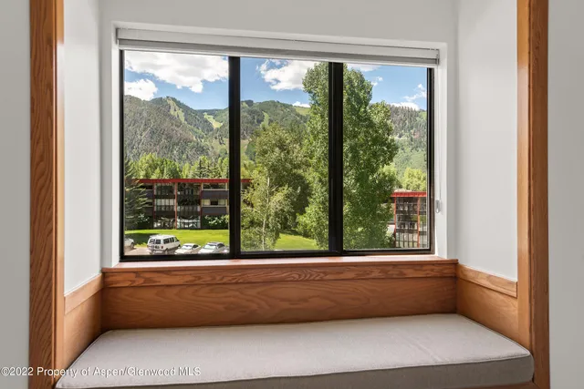 a bedroom with a large bed and dresser