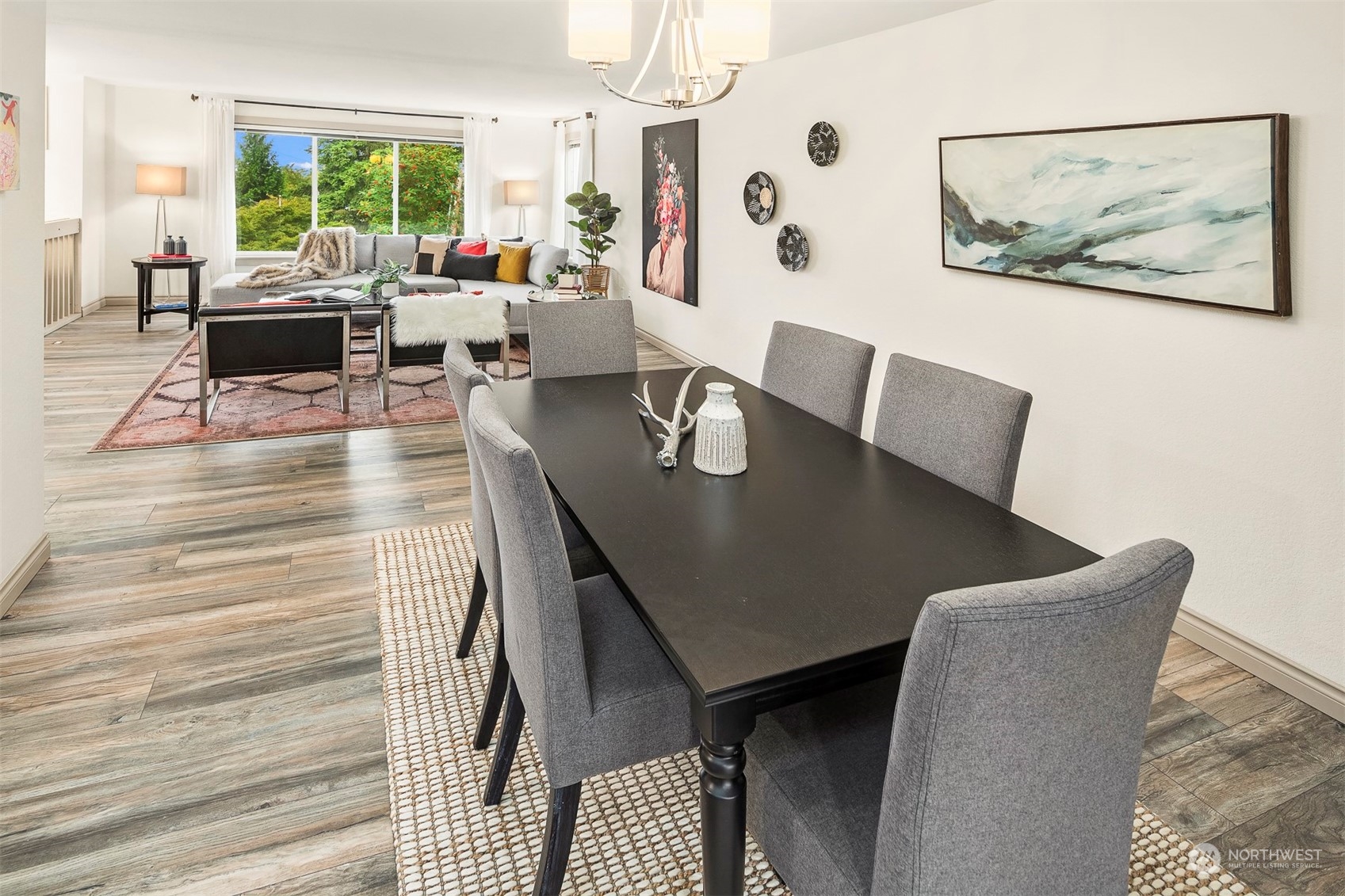 10026 Southeast 192nd Street Renton, WA 98055 - Photo 8 of 34 a view of a dining room with furniture and a large window