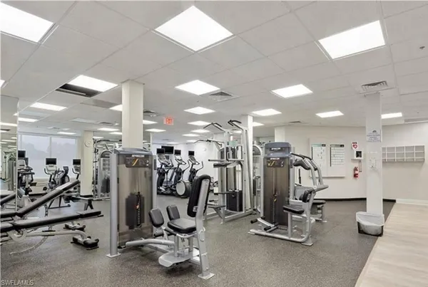 a lobby with furniture and a large window
