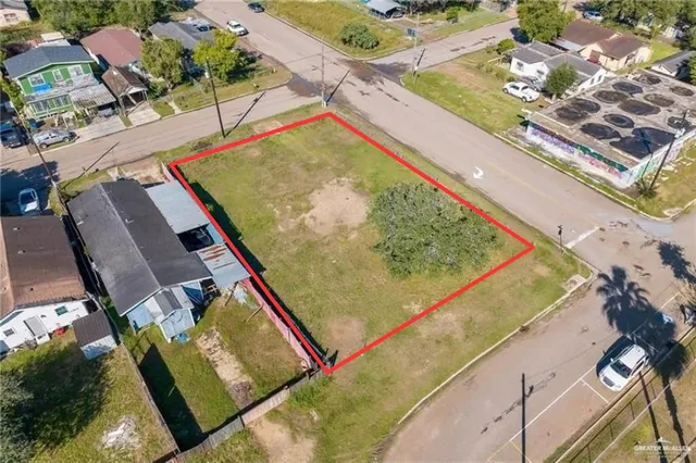 an aerial view of residential houses with outdoor space