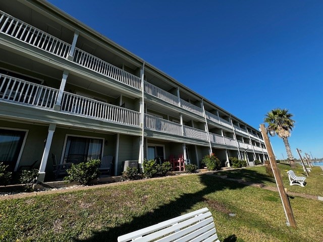 2290 North Fulton Beach Road, Unit B317 Rockport, TX 78382 - Photo 26 of 40 a front view of a house with garden