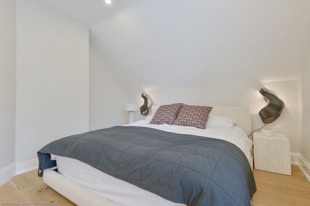 51 Fair Street Nantucket, MA 02554 - Photo 14 of 24 a bedroom with a bed and lamp