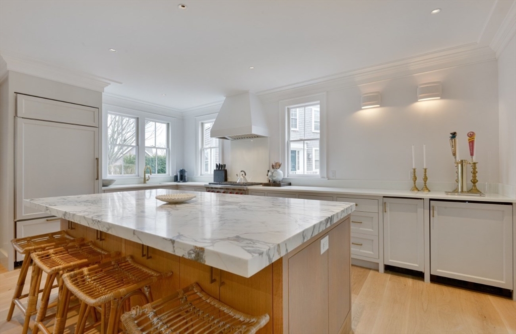 51 Fair Street Nantucket, MA 02554 - Photo 21 of 24 a view of a kitchen counter top space with wooden floor and cabinets