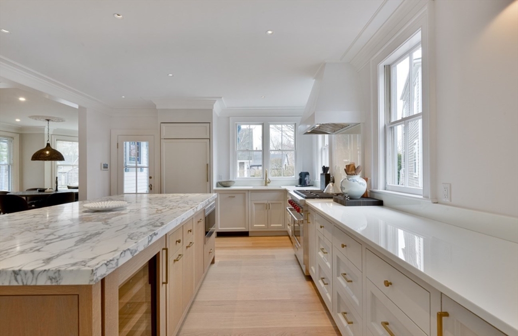 51 Fair Street Nantucket, MA 02554 - Photo 22 of 24 a large bathroom with a granite countertop double vanity sink a bathtub and window