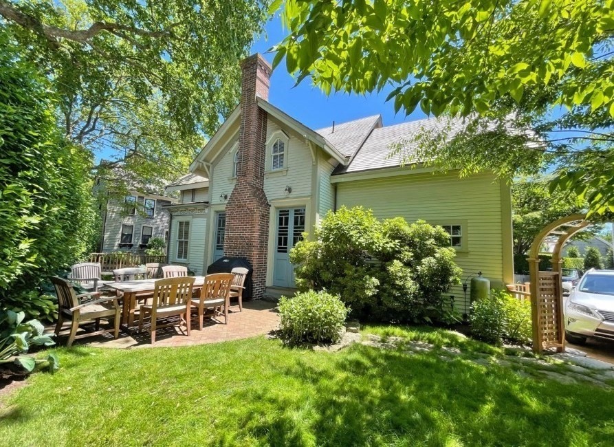 51 Fair Street Nantucket, MA 02554 - Photo 3 of 24 a view of backyard of house with green space