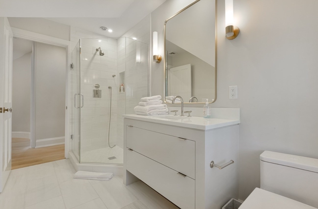 51 Fair Street Nantucket, MA 02554 - Photo 9 of 24 a bathroom with a sink a toilet and shower