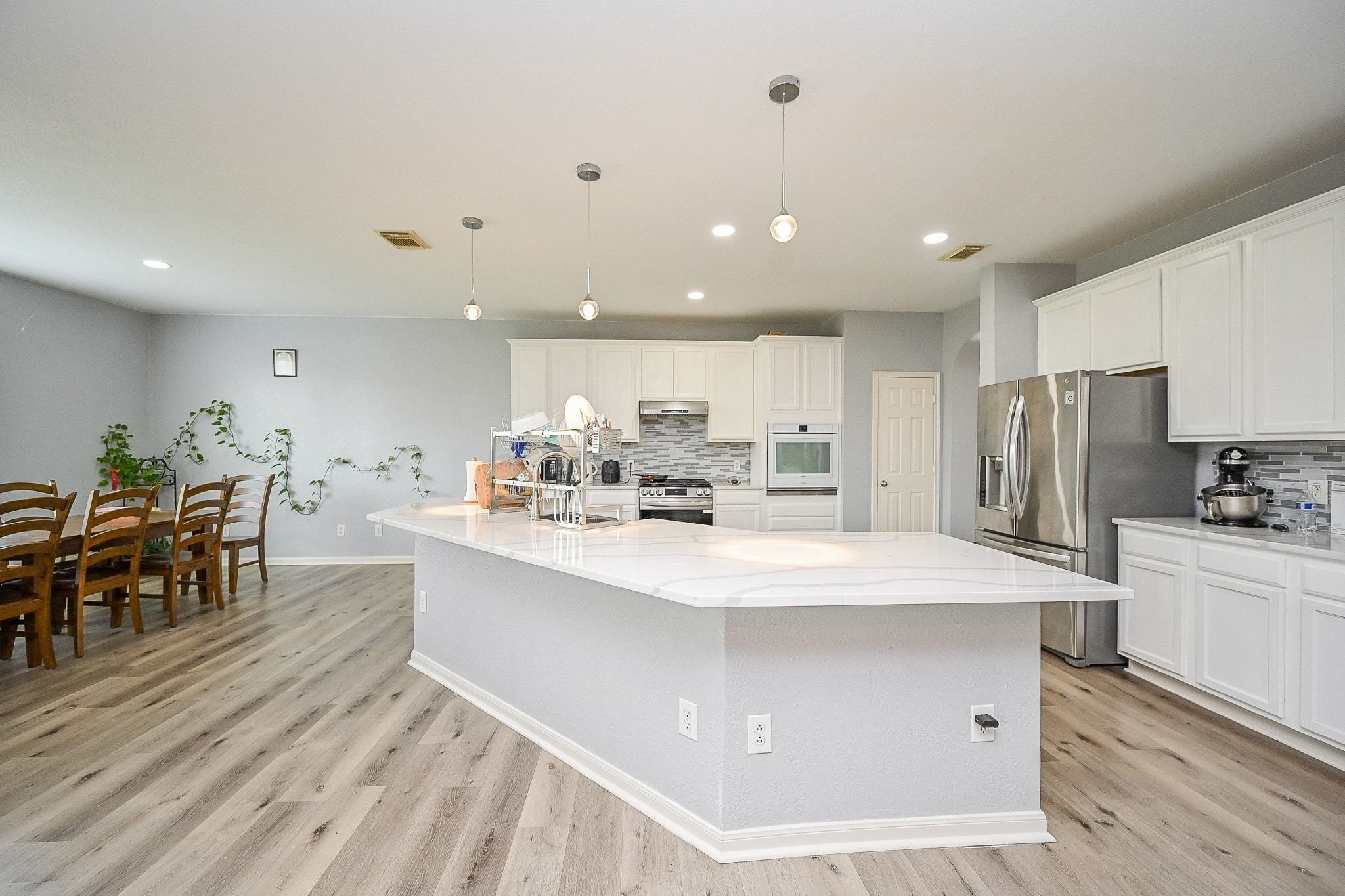 6638 Autumn Sunset Lane Spring, TX 77379 - Photo 11 of 32 Experience the elegance of this modern kitchen, featuring sleek countertops, stainless steel appliances, and ample cabinetry for a stylish and functional space.