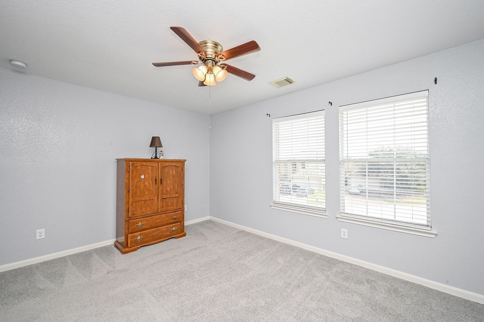 6638 Autumn Sunset Lane Spring, TX 77379 - Photo 25 of 32 Sunny and cozy bedroom with abundant natural light, ideal for relaxation.