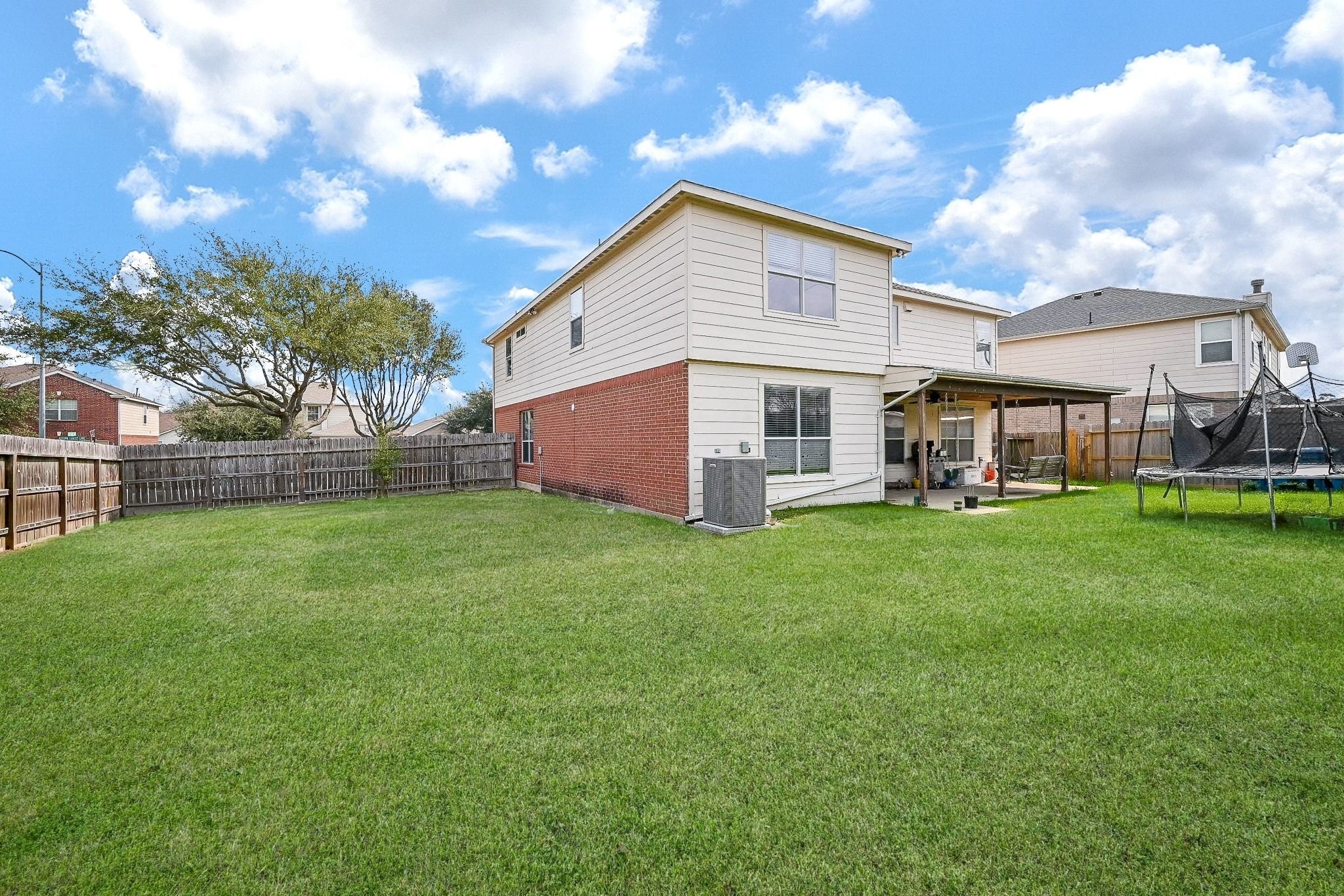 6638 Autumn Sunset Lane Spring, TX 77379 - Photo 32 of 32 Expansive backyard perfect for relaxation and outdoor activities.