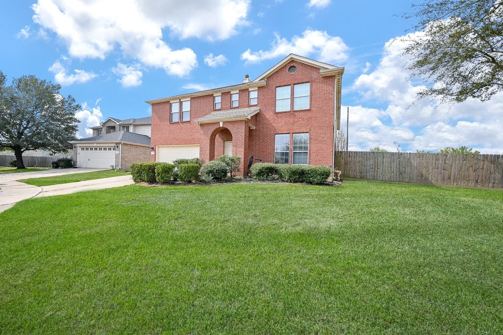 6638 Autumn Sunset Lane Spring, TX 77379 - Photo 5 of 32 Inviting front yard with charming curb appeal.
