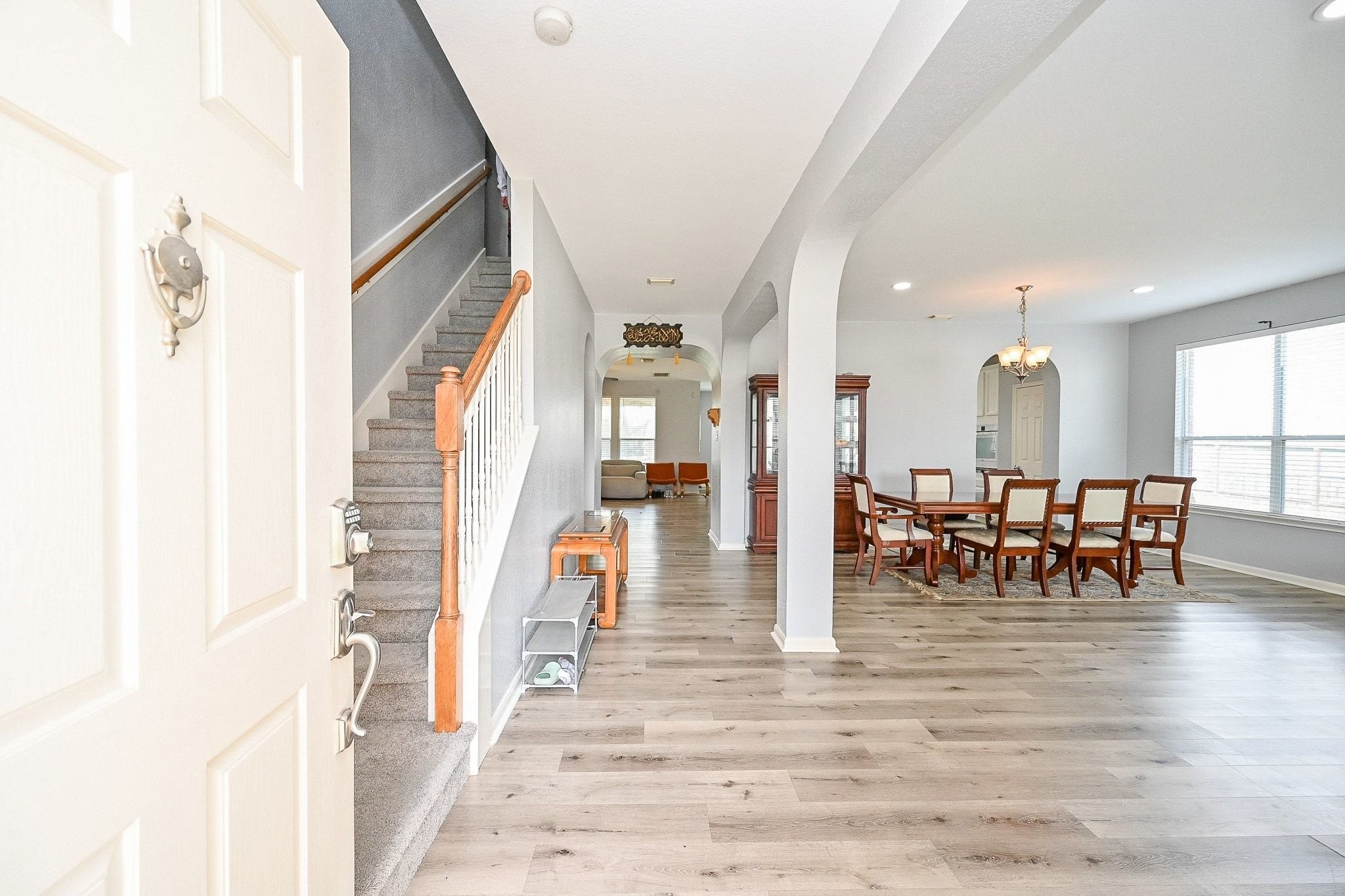 6638 Autumn Sunset Lane Spring, TX 77379 - Photo 6 of 32 Welcome to your new home! This inviting entryway features elegant flooring and leads seamlessly into a spacious dining area, perfect for entertaining. The open layout and abundant natural light create a warm and welcoming atmosphere.