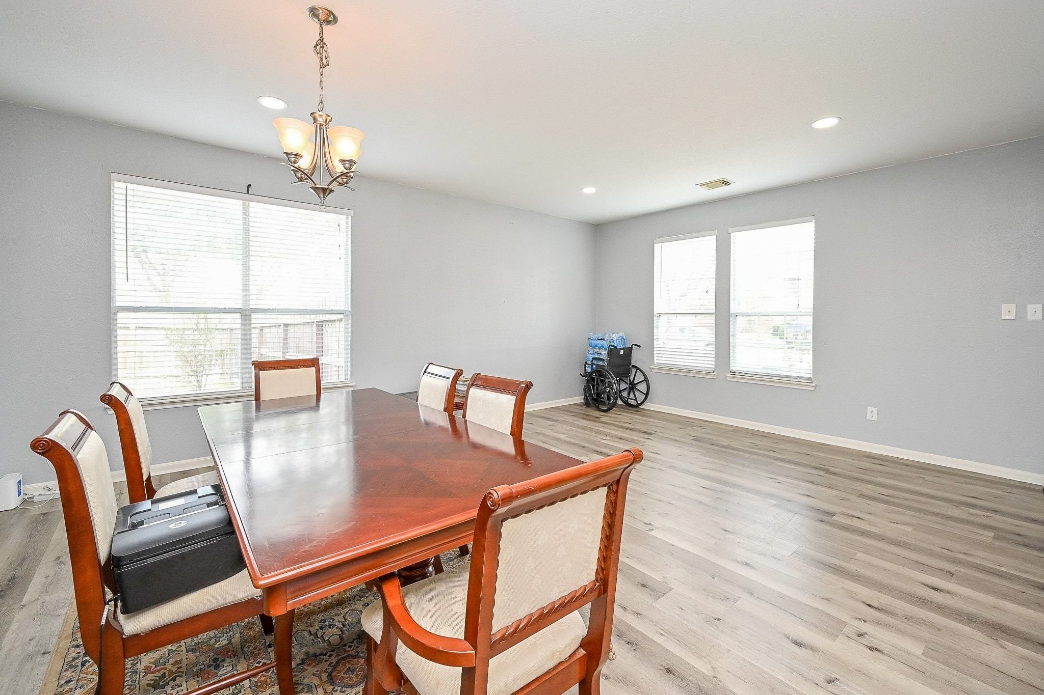 6638 Autumn Sunset Lane Spring, TX 77379 - Photo 8 of 32 Bright and spacious dining and living area with ample natural light, perfect for entertaining or relaxing.