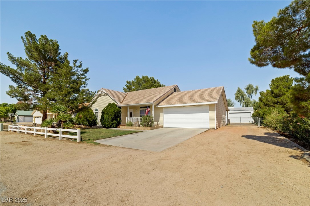 3756 Stratton Logandale, NV 89021 - Photo 1 of 42 View of front of property with concrete driveway,