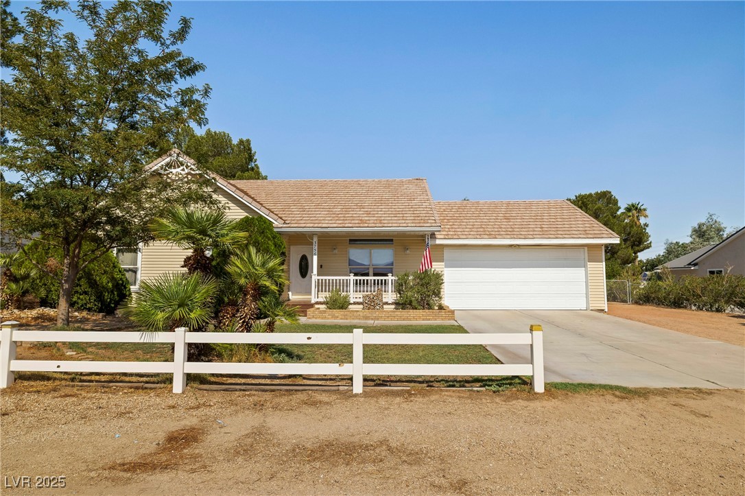 3756 Stratton Logandale, NV 89021 - Photo 3 of 42 View of front facade with driveway, covered porch,