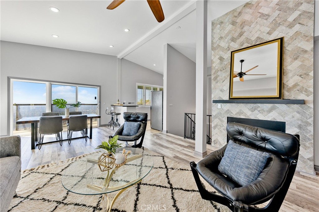 591 Devonwood Road Altadena, CA 91001 - Photo 11 of 35 a living room with furniture and a fireplace