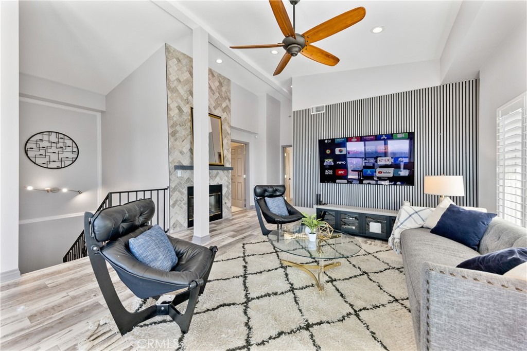 591 Devonwood Road Altadena, CA 91001 - Photo 12 of 35 a living room with furniture and a flat screen tv