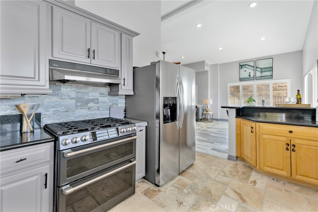 591 Devonwood Road Altadena, CA 91001 - Photo 19 of 35 a kitchen with granite countertop cabinets and steel stainless steel appliances
