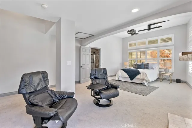 a bedroom with furniture and a gym equipment