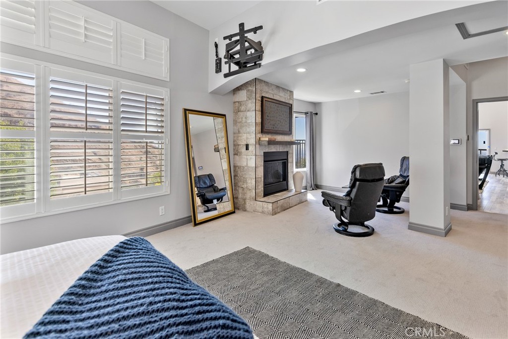 591 Devonwood Road Altadena, CA 91001 - Photo 22 of 35 a bedroom with furniture and a gym equipment