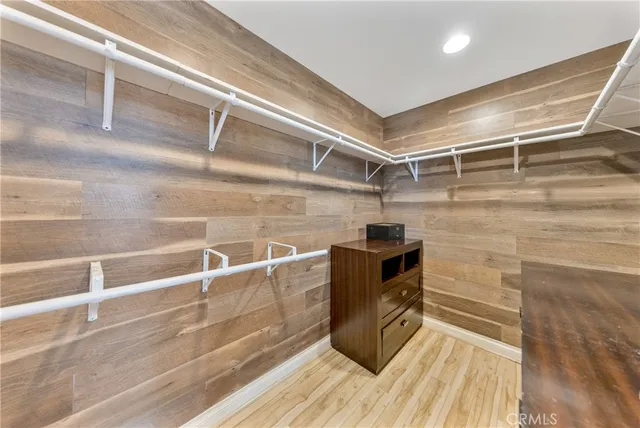 a bathroom with a tub a sink and a mirror