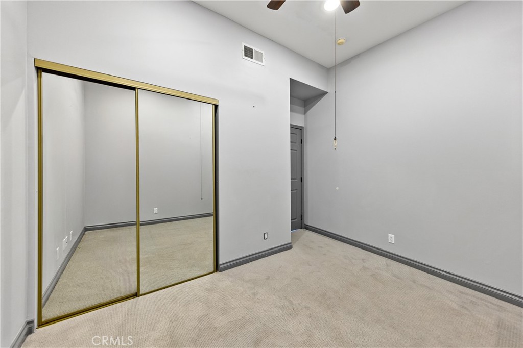 591 Devonwood Road Altadena, CA 91001 - Photo 29 of 35 an empty room with windows and closet