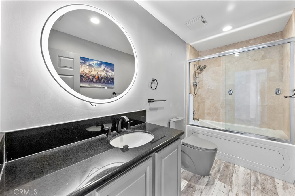 591 Devonwood Road Altadena, CA 91001 - Photo 30 of 35 a bathroom with a sink and a mirror