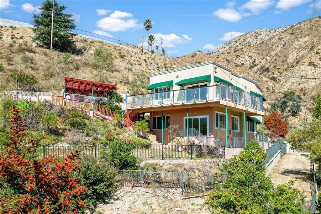 591 Devonwood Road Altadena, CA 91001 - Photo 34 of 35 a front view of a house with a yard and potted plants