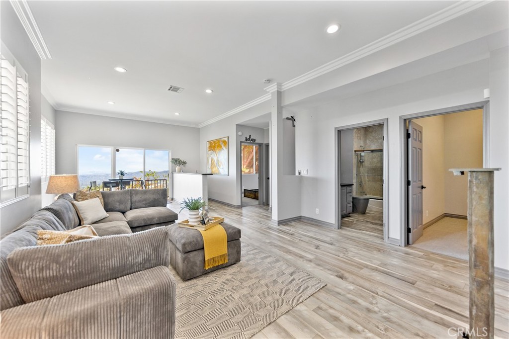 591 Devonwood Road Altadena, CA 91001 - Photo 7 of 35 a living room with furniture and a wooden floor