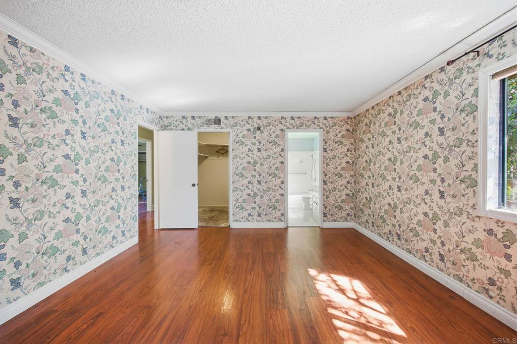 2807 South Grade Road Alpine, CA 91901 - Photo 21 of 42 a view of a hallway with wooden floor and large windows