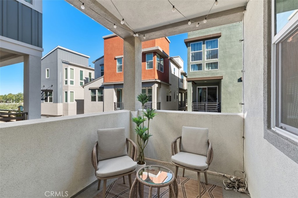 155 Fable Irvine, CA 92618 - Photo 18 of 41 a view of a patio with couches table and chairs and potted plants