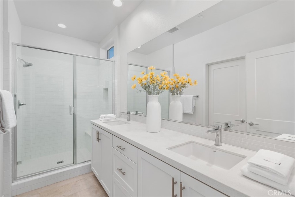 155 Fable Irvine, CA 92618 - Photo 21 of 41 a bathroom with a double vanity sink mirror and shower