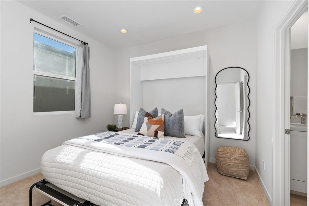 155 Fable Irvine, CA 92618 - Photo 22 of 41 a bedroom with a bed and a mirror