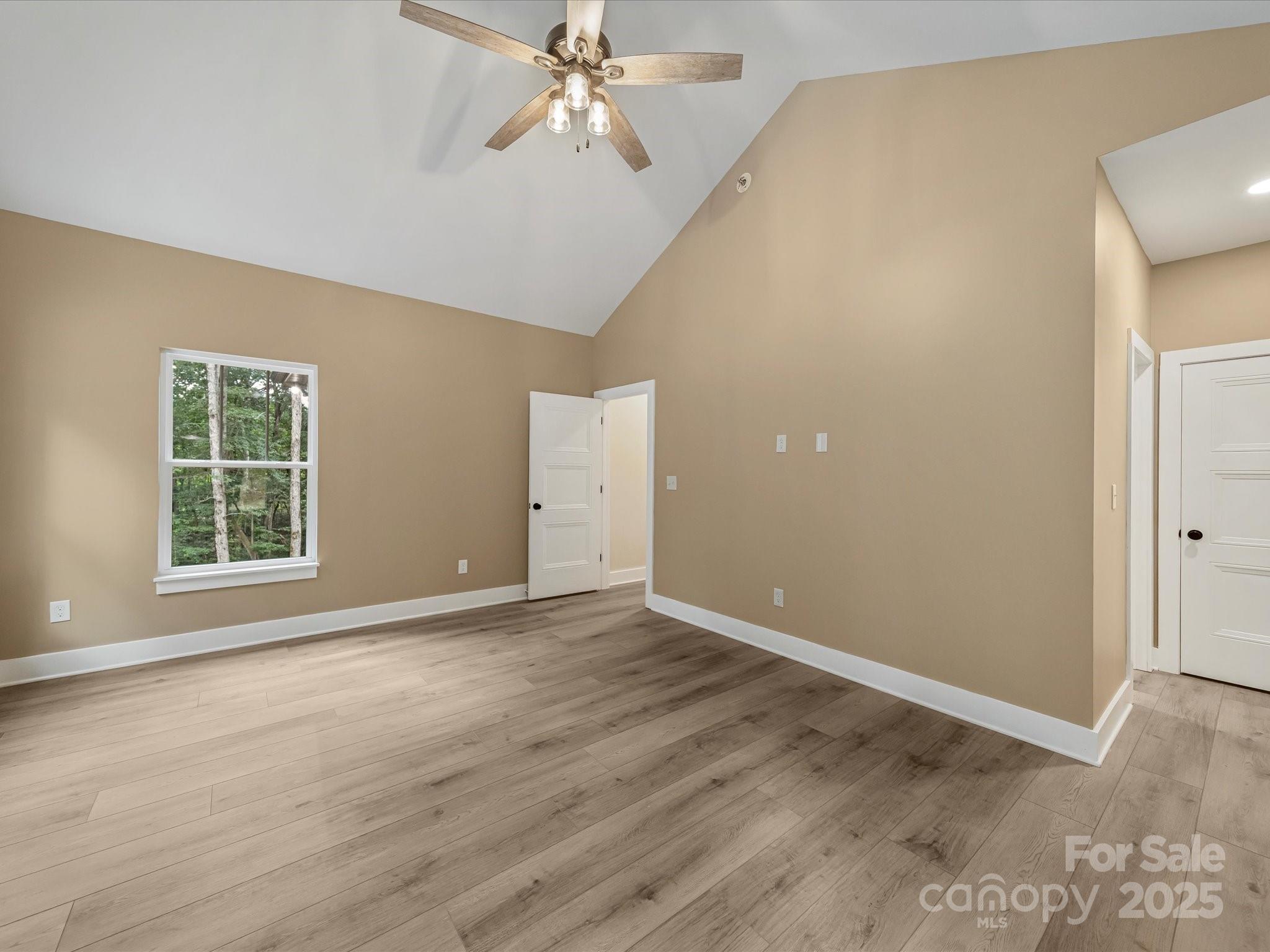 110 Rupard Road Statesville, NC 28625 - Photo 28 of 45 an empty room with wooden floor fan and windows